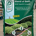 Penny's Green Blend of Both topsoil and compost package in a greenhouse setting