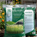 Two bags of horse manure with a Pennys brand logo on a garden background.