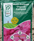Packs of Pennys Green Multi-Purpose Organic Compost on a wooden pallet.