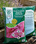 Penny Green multi-purpose organic compost bag with flowers and gardening tools in the background