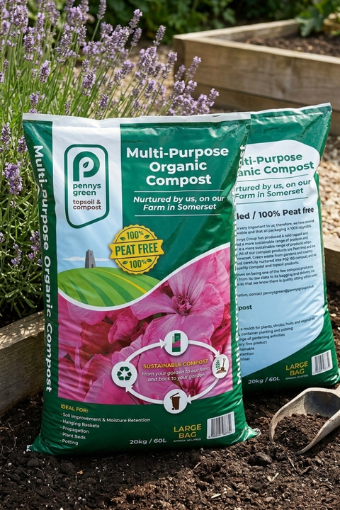 Penny Green multi-purpose organic compost bag with flowers and gardening tools in the background